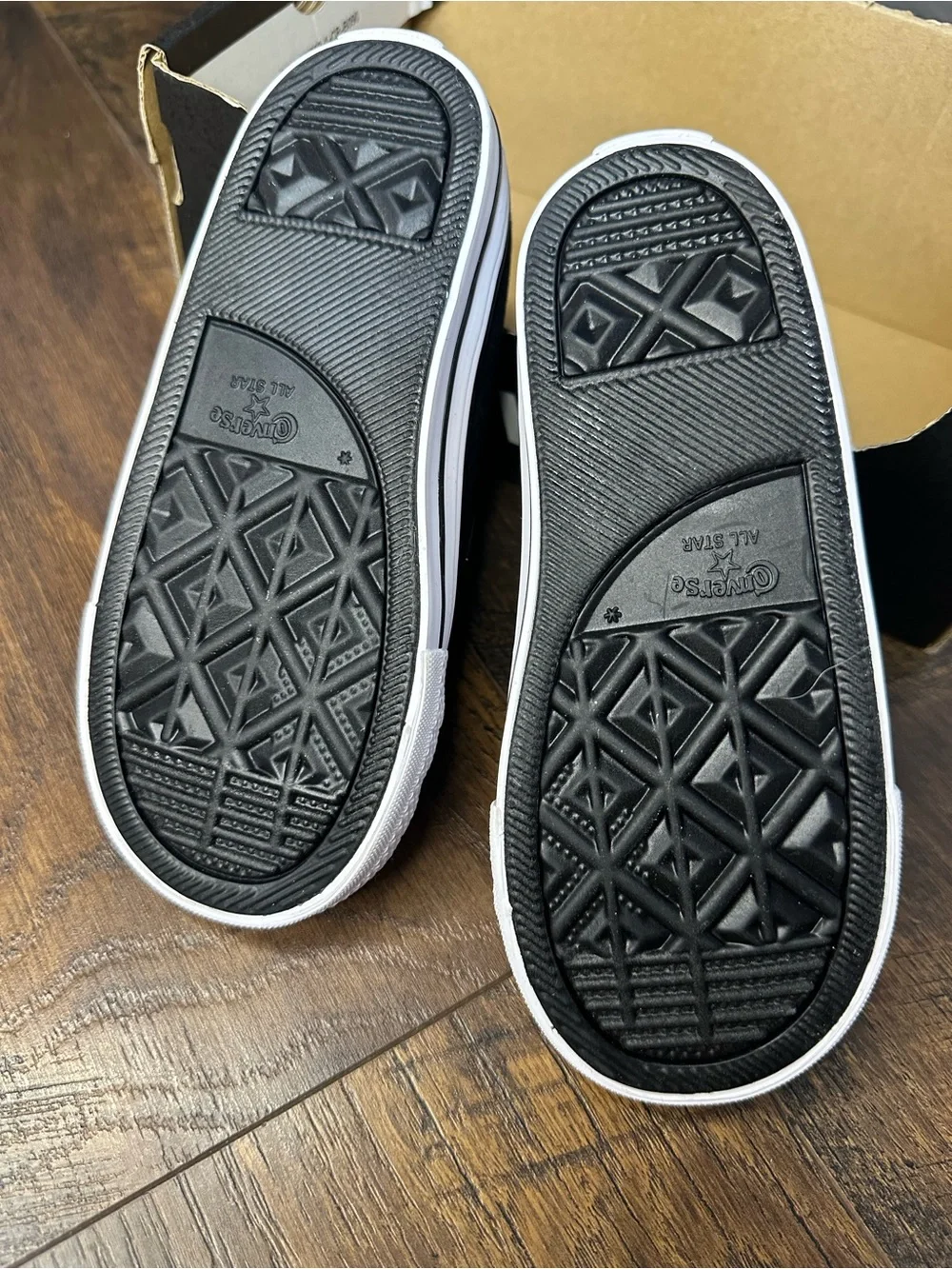 Converse Kids Black Penguin Slip-On Sneakers with Blue Eyes and Orange Beak